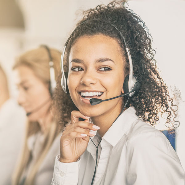 Receptionist using telephone headset